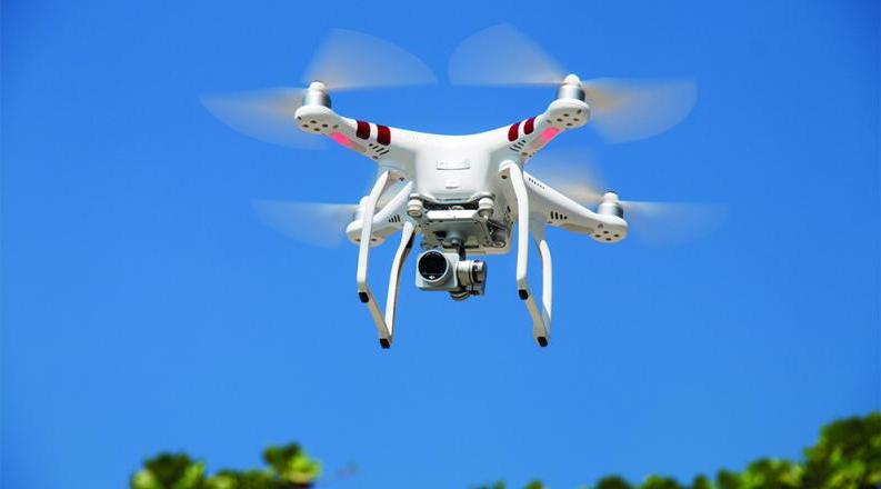 drone-flying-against-blue-sky