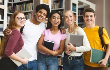 Group of students studying in library at university