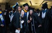 A group of students smile and pose together for a photo.